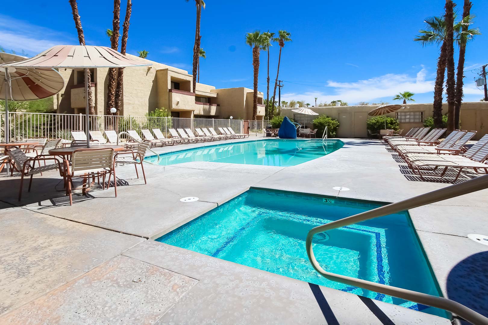 A peaceful outdoor swimming pool at VRI's Desert Vacation Villas in Palm Springs California.